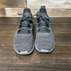 Adidas Kaptir running shoes in a charcoal grey and black knit material